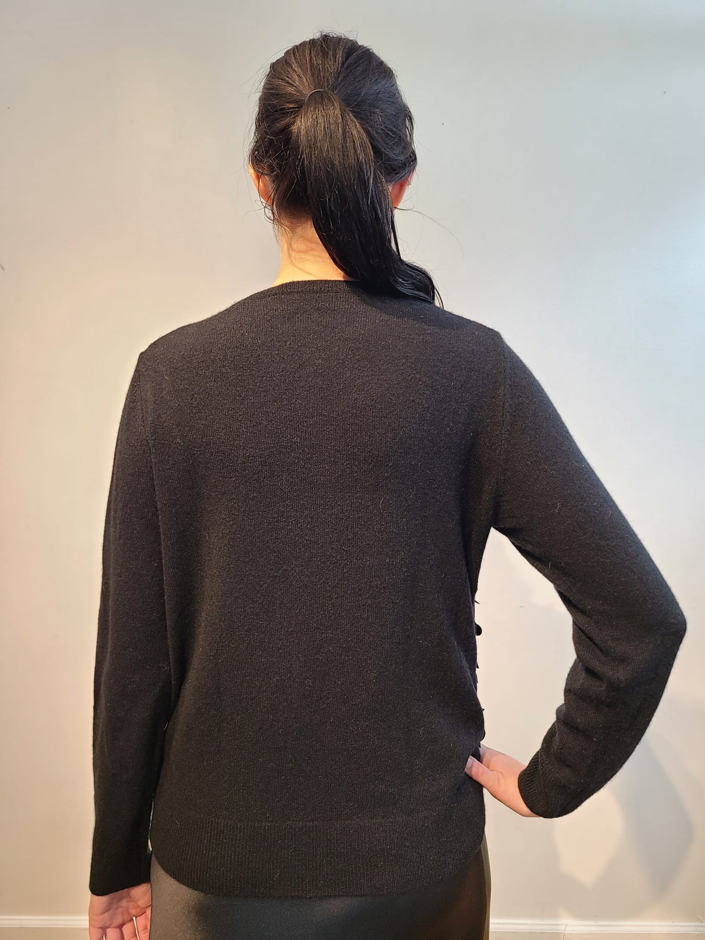 BLACK CASHMERE CREW NECK LONG SLEEVE WITH FRONT BLACK 3D VEGAN LEATHER FLOWERS WITH JET BEAD STERNUM ON BLACK SATIN PERGOLA ON BLACK TULLE (SIZE M)