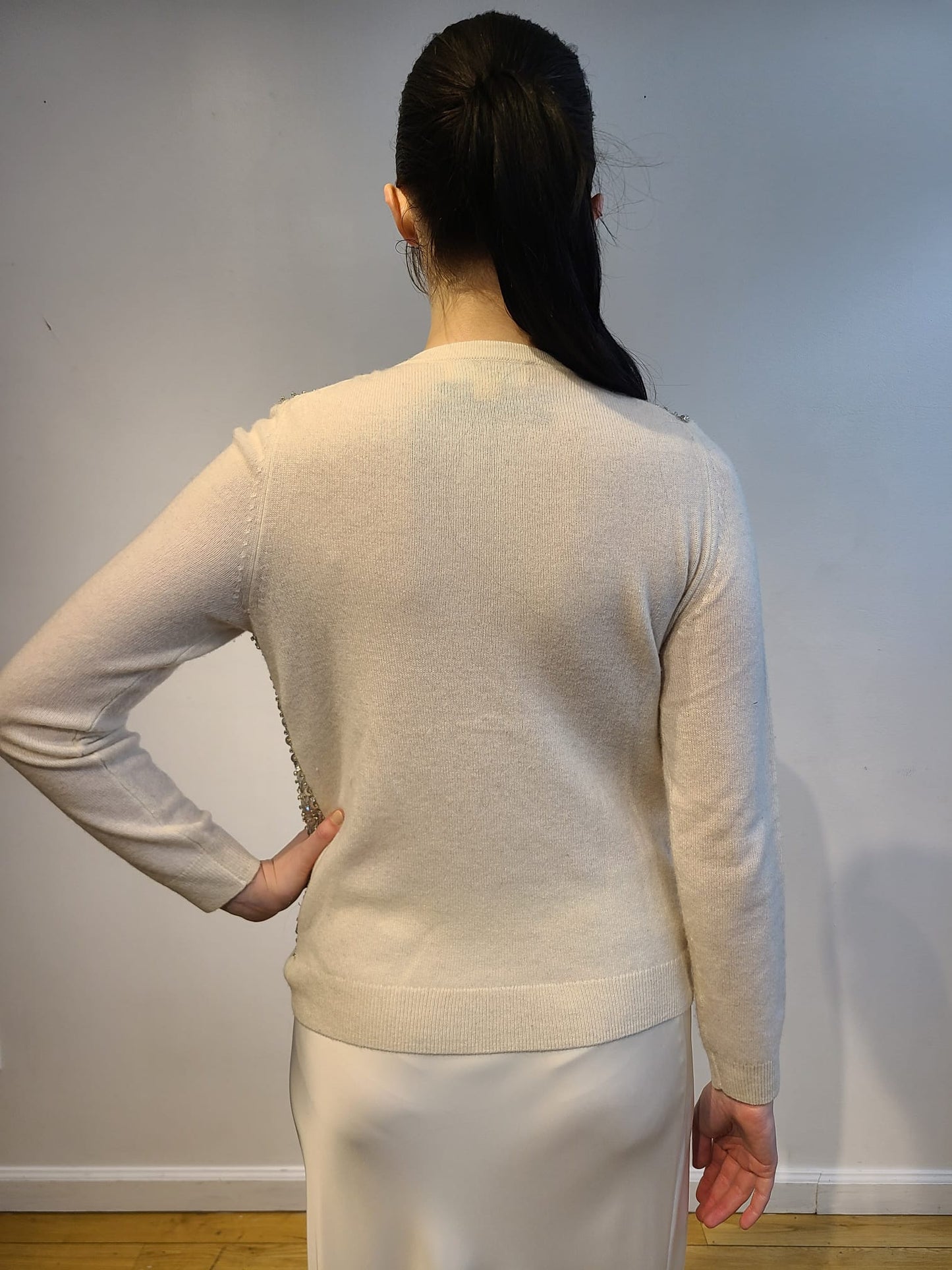 WHITE CASHMERE LONG SLEEVE BUTTON FRONT CARDIGAN WITH FRONT EMBELLISHED FUTURISTIC SILVER DISCS & CRYSTAL BEADS ON DOVE GRAY TULLE(SIZE S)