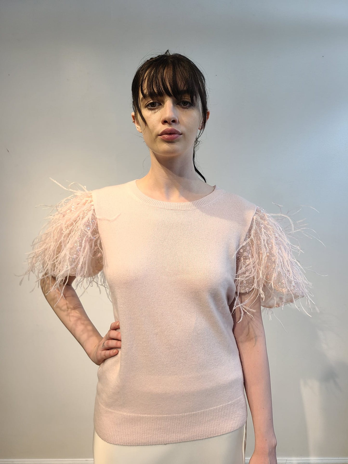 PINK CASHMERE CREW NECK LONG SLEEVE WITH FRONT EMBELLISHED PINK OPALESCENT SEQUINS & FEATHERS FLYING ON PINK TULLE (SIZE L)