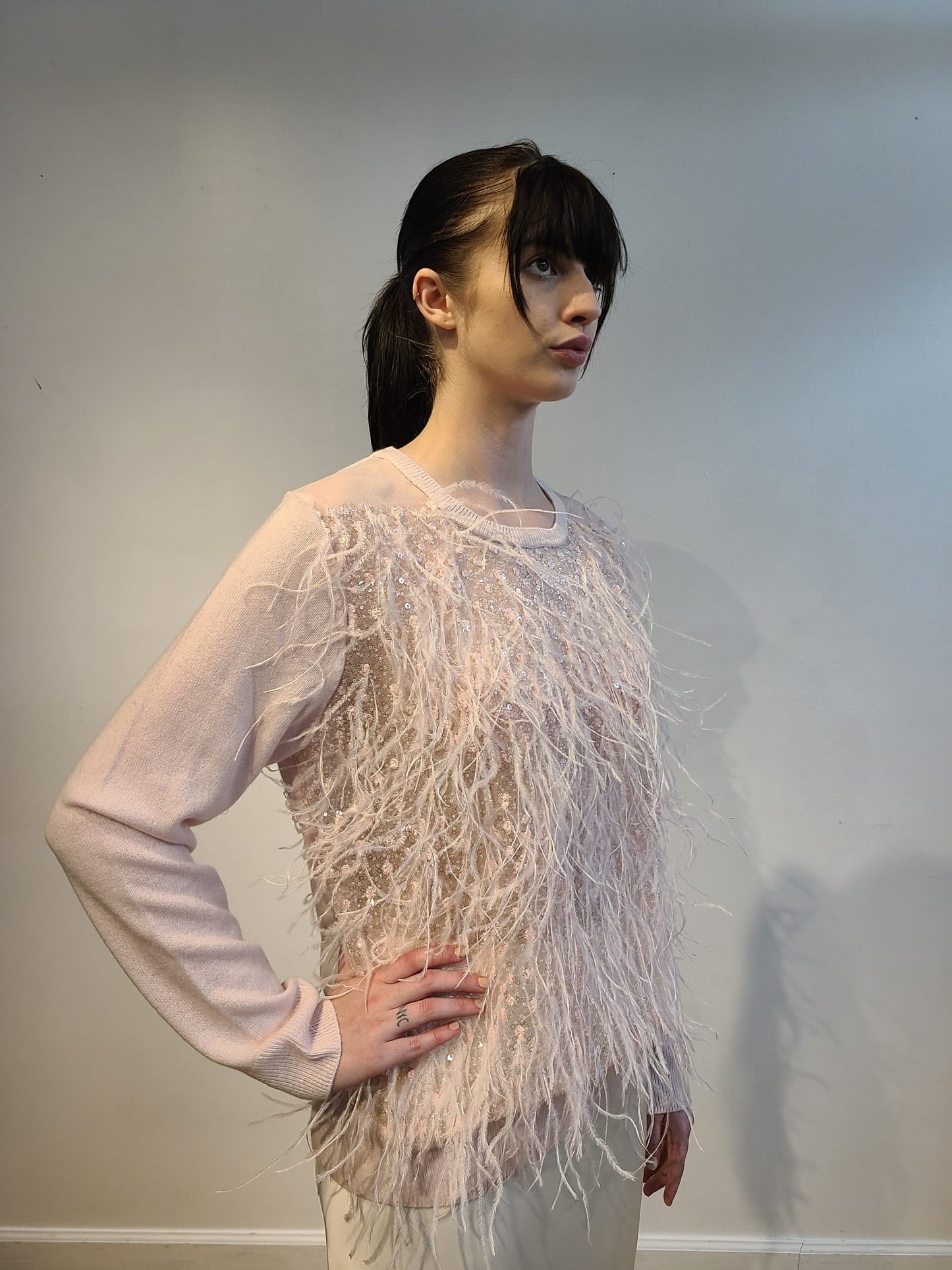 PINK CASHMERE CREW NECK LONG SLEEVE WITH FRONT EMBELLISHED PINK OPALESCENT SEQUINS & FEATHERS FLYING ON PINK TULLE(SIZE L)
