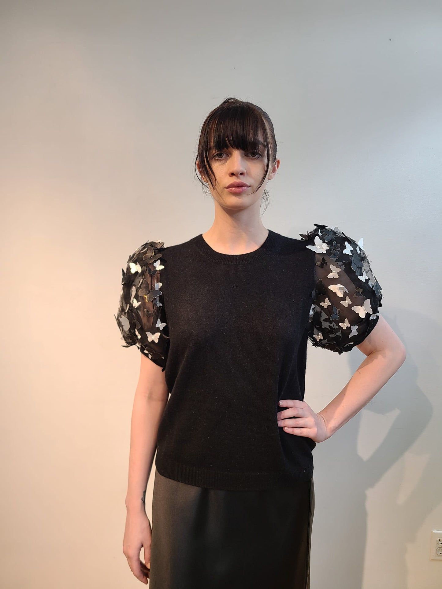 BLACK CASHMERE T SHIRT WITH VOLUMINOUS SHORT PUFF SLEEVE EMBELLISHED OF BLACK & WHITE 3D BUTTERFLIES WITH GOLD TRIM FLYING FREE (SIZE L)