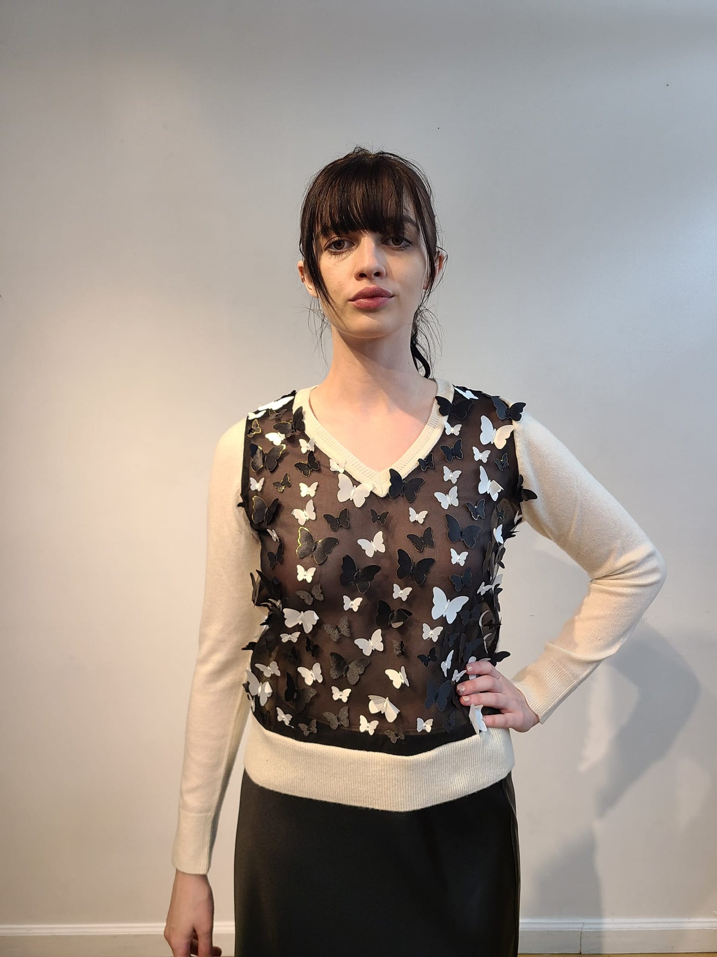 IVORY CASHMERE V NECK LONG SLEEVE WITH EMBELLISHED FRONT OF BLACK AND WHITE 3D BUTTERFLIES WITH GOLD TRIM FLYING FREE ON BLACK TULLE (SIZE S)