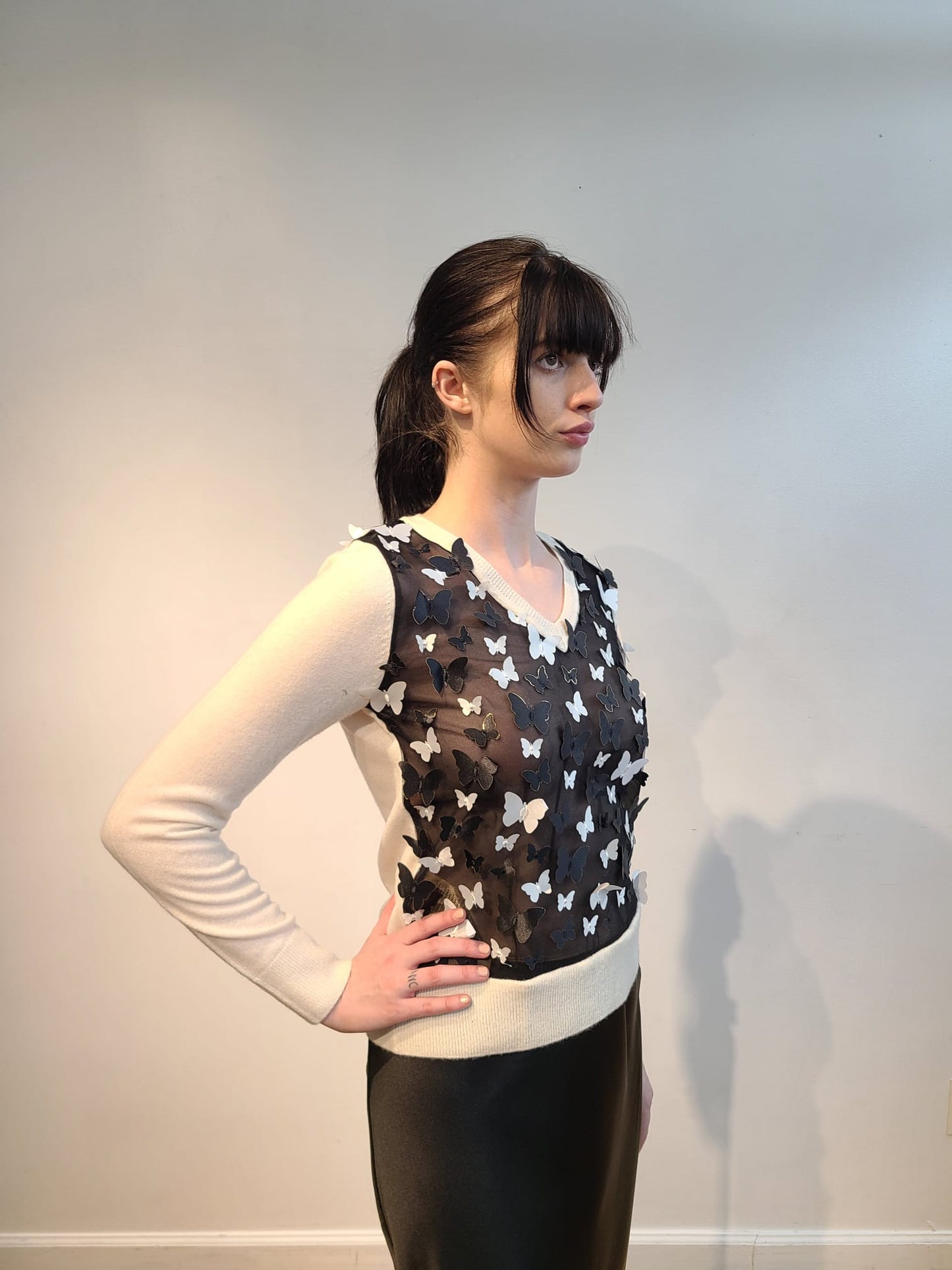 IVORY CASHMERE V NECK LONG SLEEVE WITH EMBELLISHED FRONT OF BLACK AND WHITE 3D BUTTERFLIES WITH GOLD TRIM FLYING FREE ON BLACK TULLE (SIZE S)