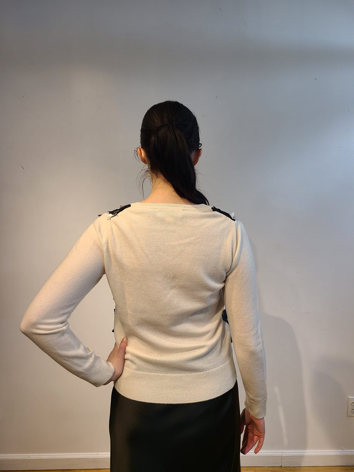 IVORY CASHMERE V NECK LONG SLEEVE WITH EMBELLISHED FRONT OF BLACK AND WHITE 3D BUTTERFLIES WITH GOLD TRIM FLYING FREE ON BLACK TULLE (SIZE S)