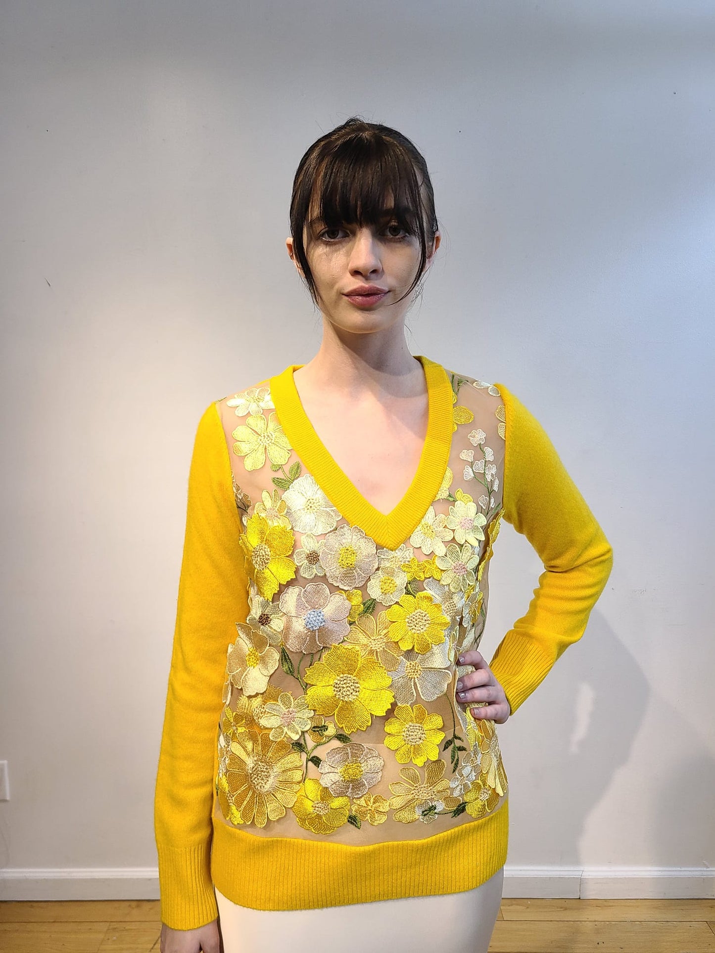 YELLOW CASHMERE LONG SLEEVE V NECK WITH FRONT BUTTERCUP YELLOW, PALE PINK AND CREAM FLOWERS WITH GREEN VINES EMBELLISHED ON NUDE TULLE (SIZE L)