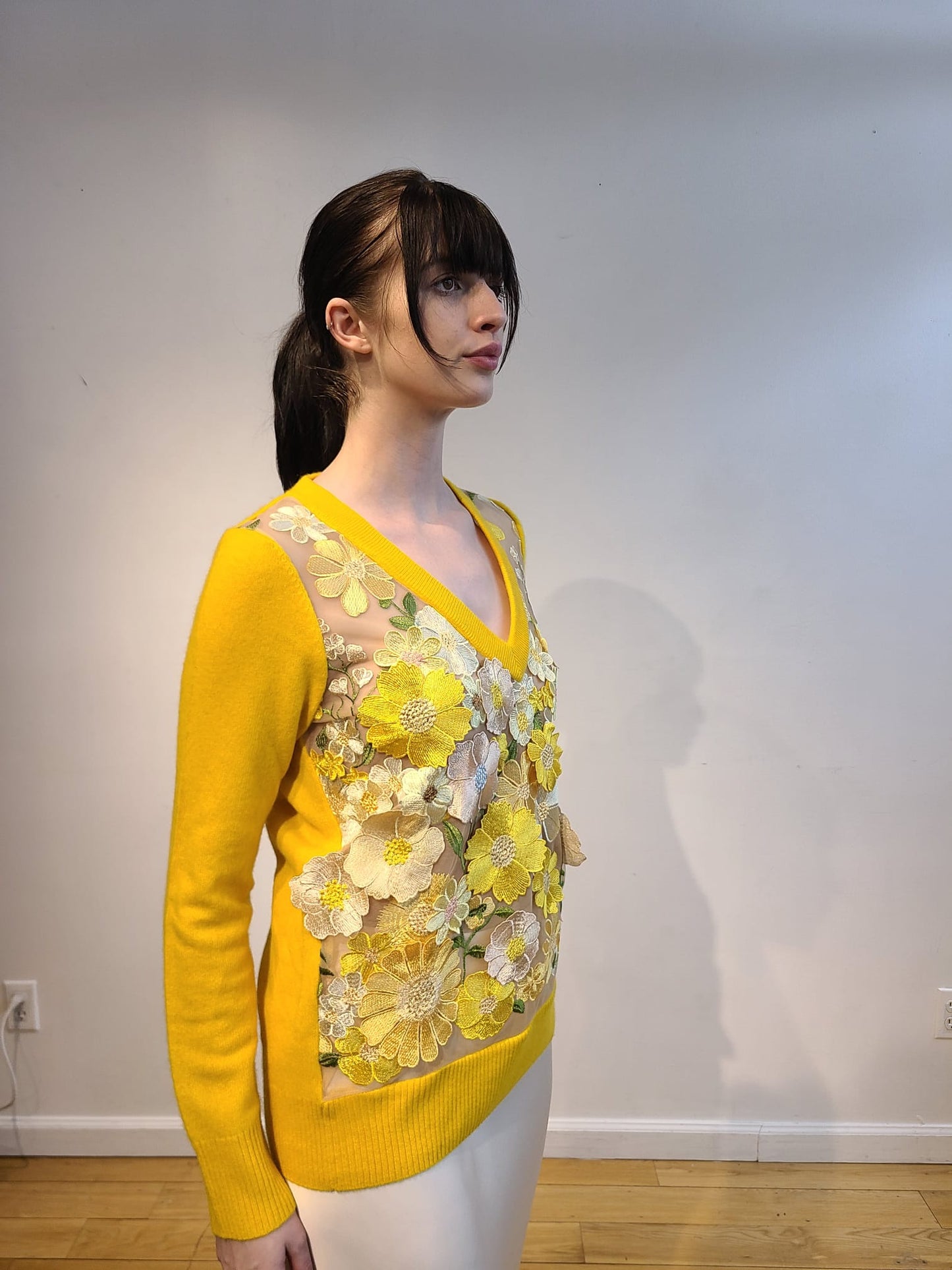 YELLOW CASHMERE LONG SLEEVE V NECK WITH FRONT BUTTERCUP YELLOW, PALE PINK AND CREAM FLOWERS WITH GREEN VINES EMBELLISHED ON NUDE TULLE (SIZE L)