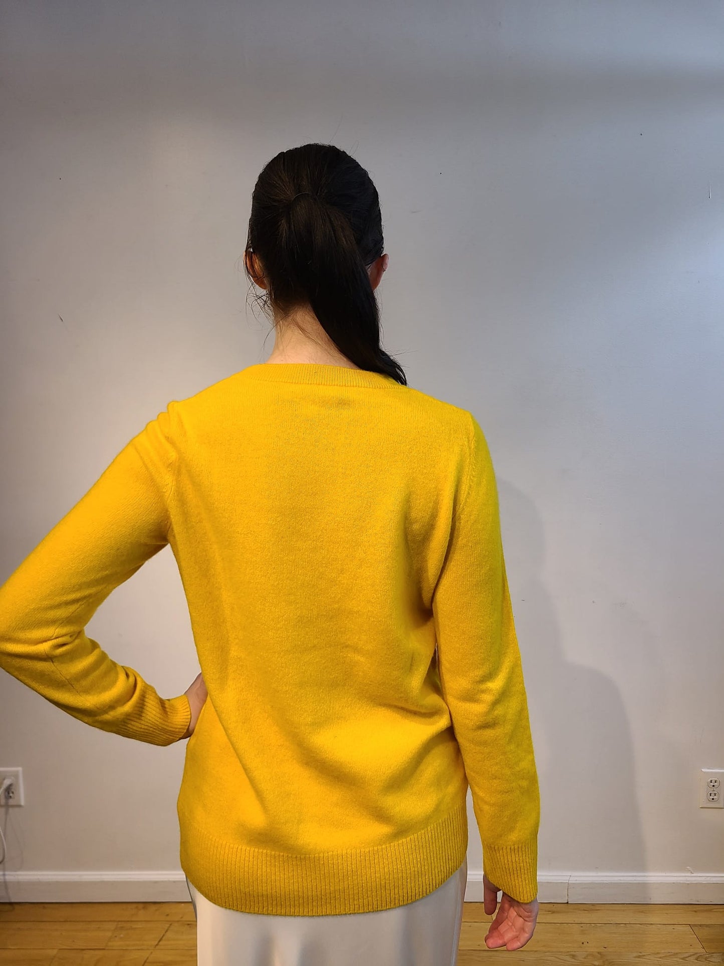 YELLOW CASHMERE LONG SLEEVE V NECK WITH FRONT BUTTERCUP YELLOW, PALE PINK AND CREAM FLOWERS WITH GREEN VINES EMBELLISHED ON NUDE TULLE (SIZE L)
