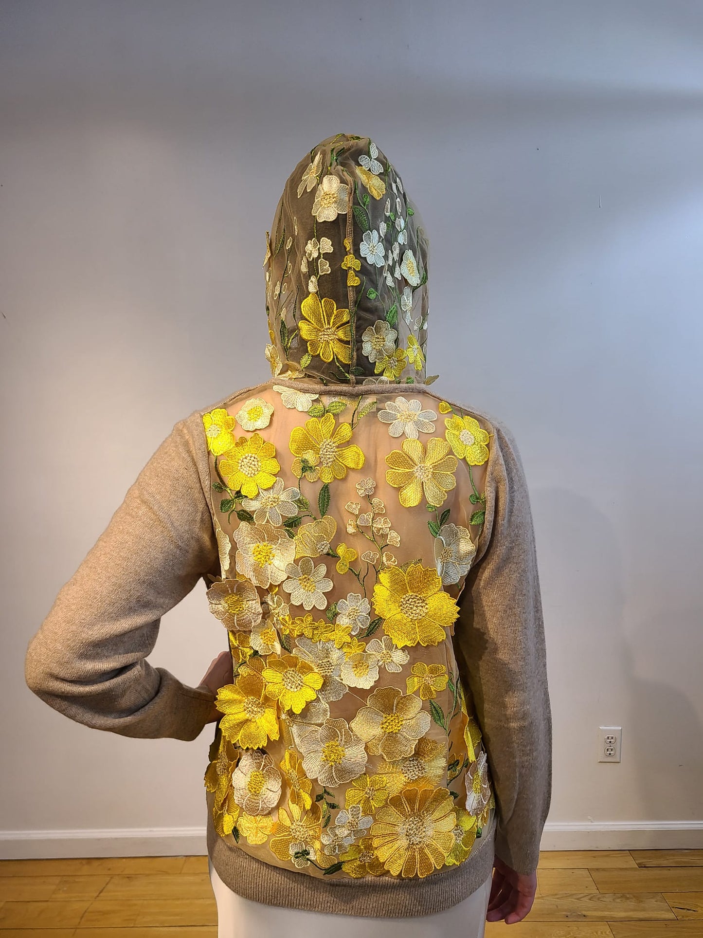 OATMEAL CASHMERE HOODIE WITH BACK HOOD WITH BUTTERCUP YELLOW, PALE PINK AND CREAM FLOWERS WITH GORGEOUS GREEN VINES EMBELLISHED ON NUDE TULLE (SIZE M)
