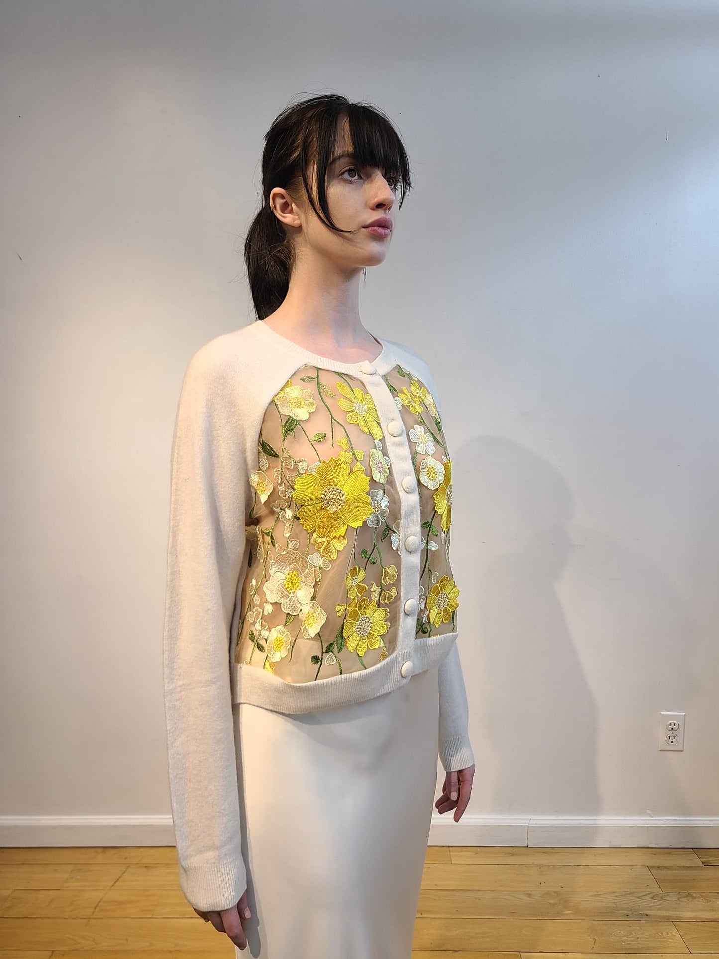 IVORY CASHMERE CROPPED CARDIGAN WITH FRONT BUTTERCUP YELLOW, PALE PINK AND CREAM FLOWERS WITH GORGEOUS GREEN VINES EMBELLISHED ON NUDE TULLE (SIZE L)