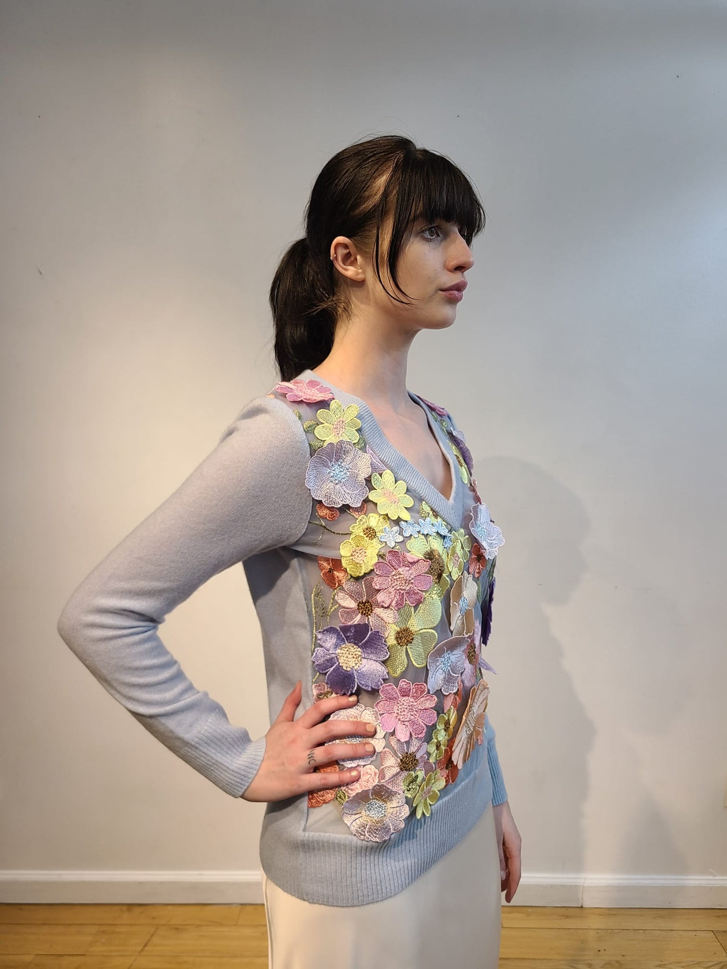 BABY BLUE CASHMERE V NECK LONG SLEEVE WITH FRONT EMBELLISHED WITH PINK/ CORAL/ YELLOW AND LAVENDER FLOWERS ON BABY BLUE TULLE (SIZE S)