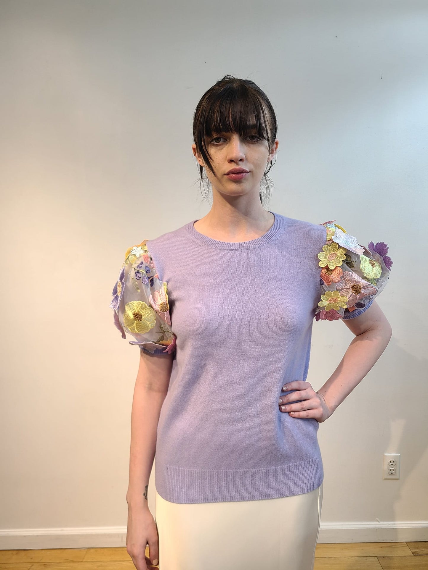 LAVENDER CASHMERE CREW NECK WITH SHORT PUFF SLEEVE EMBElLISHED WITH PINK/CORAL/YELLOW AND LAVENDER FLOWERS ON BABY BLUE TULLE & SLEEVES (SIZE S)