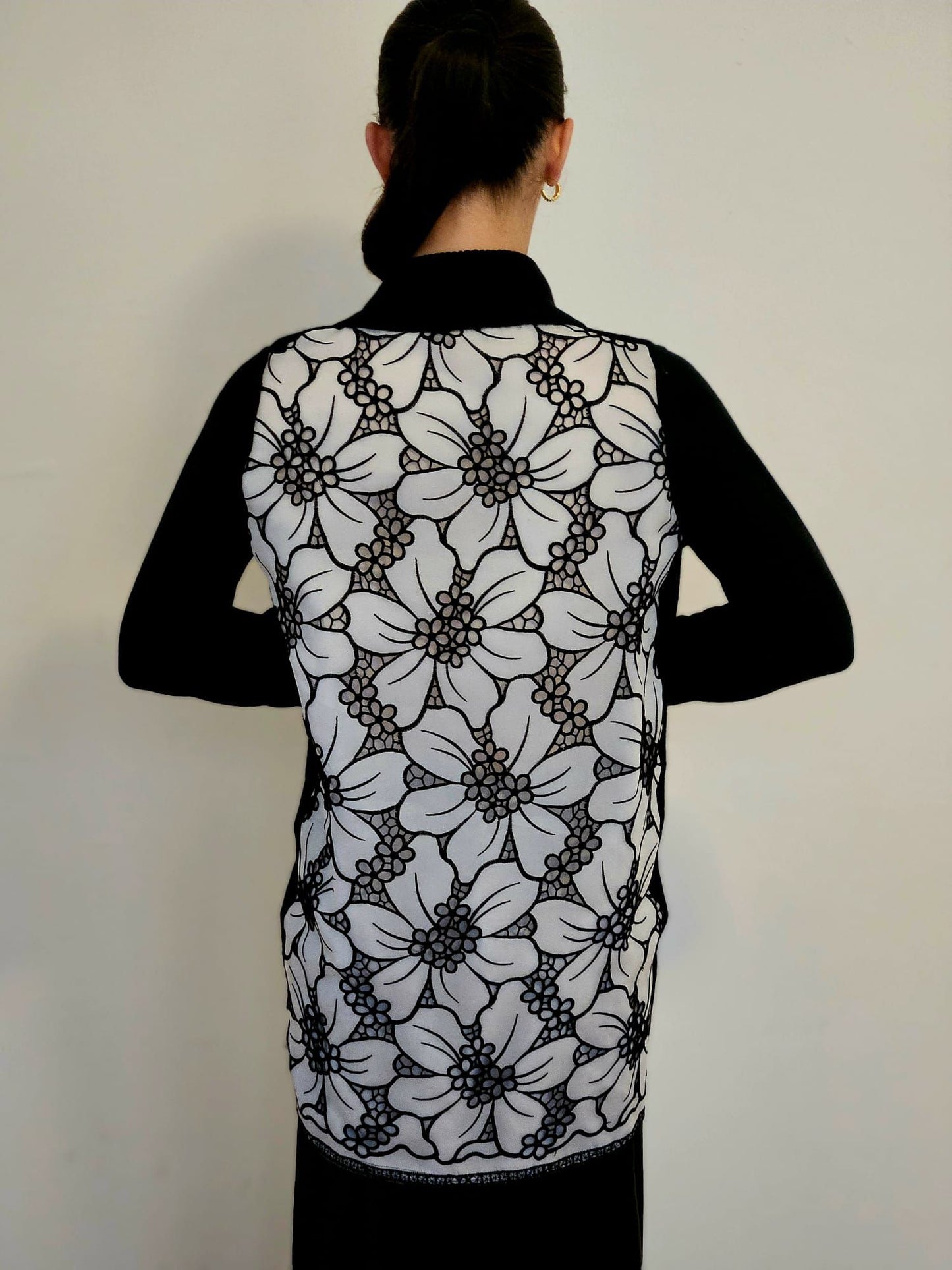 M/L BLACK CASHMERE LONG SLEEVE SWING CARDIGAN WITH WHITE SILK ORGANZA FLOWERS WITH BLACK OVERSTITCHED TRIM AND PETITE FLORAL CUTOUTS ON BACK