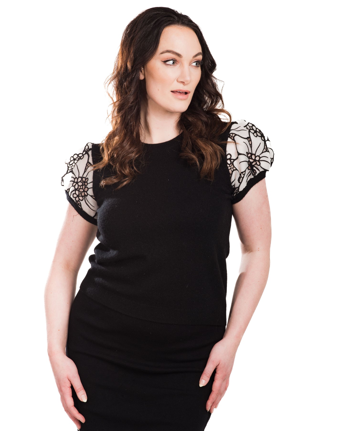 LARGE BLACK CREW NECK CASHMERE SWEATER WITH SHORT PUFF SLEEVES OF WHITE SILK ORGANZA FLOWERS WITH BLACK OVERSTITCHED TRIM AND PETITE FLORAL CUTOUTS