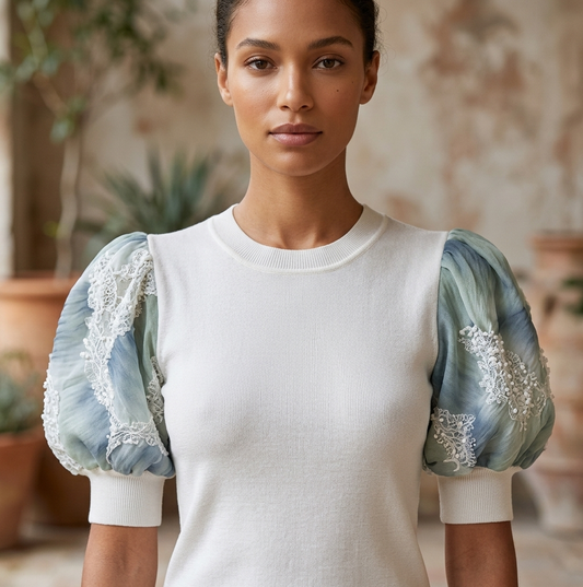 SMALL WHITE 100% CASHMERE CREW NECK TEE WITH PUFF SLEEVES ENCRUSTED WITH WAVES OF MIRCO SEQUINS MINI PEARLS AND TINY CRYSTAL BEADS EMBROIDERED ON PIN TUCED EMBROIDERED ON PIN TUCKED ANGEL WHITE TULLE AND SHADES OF SKY BLUE TULLE