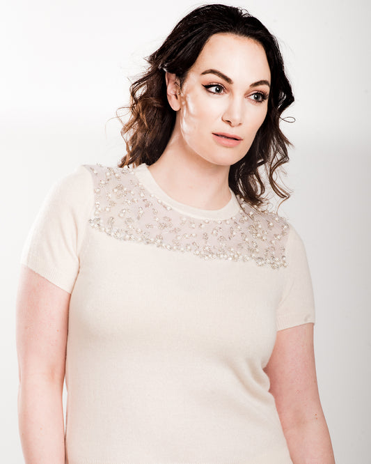 LARGE WHITE SHORT SLEEVE CREW NECK CASHMERE SWEATER WITH FRONT AND BACK PEEKABOO DETAIL OF PEARL, CRYSTAL AND MINI SEQUIN BEADING EMBROIDERED ON WHITE TULLE WITH WHITE SILK ORGANZA LINING