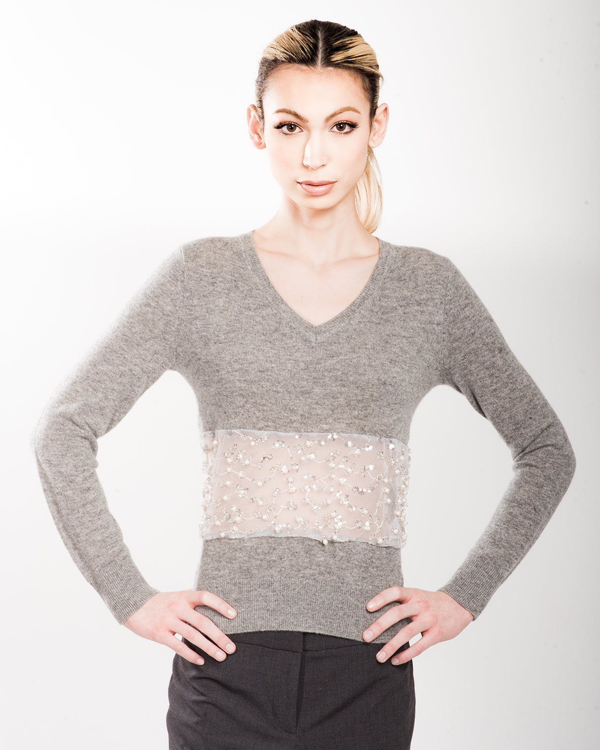 XS GREY LONG SLEEVE V-NECK CASHMERE SWEATER WITH FRONT WAIST PEEKABOO DETAIL OF PEARL, CRYSTAL AND MINI SEQUIN BEADING EMBROIDERED ON WHITE TULLE WITH WHITE SILK ORGANZA LINING